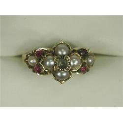 A cultured pearl, ruby and emerald ring set in yellow metal (tests gold), circa 1900 Est. 150/200...