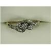 Image 1 : A 3-stone diamond crossover ring with diamond set shoulders, set in 18ct gold and platinum Est. 1...