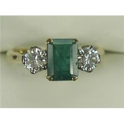 An emerald and diamond 3-stone ring, size K 1/2 (total diamond weight approx 0.80ct) Est. 550/650...