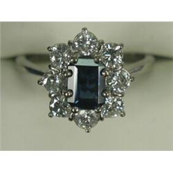 A sapphire and diamond cluster ring set in white metal (tests 18ct gold), size M, (total diamond...