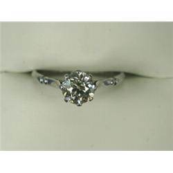 An old cut diamond solitaire (approx 1ct) ring set in white metal (tests platinum), size M 1/2 Es...