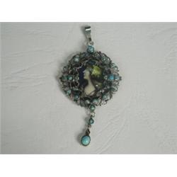 A Limoges enamelled pendant within a white metal (tests silver) frame set with turquoise, 5cm lon...