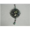 Image 1 : A Limoges enamelled pendant within a white metal (tests silver) frame set with turquoise, 5cm lon...