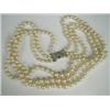 Image 1 : A three row graduated necklace of cultured pearls from 5.6 to 9.1mm in diameter, with a rose cut...