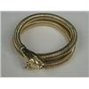 Image 1 : A yellow metal (tests gold) snake bangle with old-cut diamond set eyes and an emerald to its head...