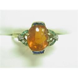 A dress ring set with a cabochon fire opal, calibre sapphires and emeralds and two diamonds in ye...