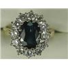 Image 1 : A sapphire and diamond cluster ring, the central sapphire of approx 10 x 8mm surrounded by twelve...
