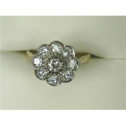 A 9-stone diamond cluster ring set in 18ct gold, size K Est. 400/500...