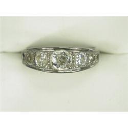 A 7-stone old cut diamond ring set in white metal (tests 18ct gold) (central stone approx 0.75ct)...