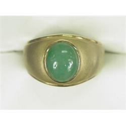A gold bombe ring set with a jadeite jade cabochon, size Q Est. 100/150...