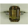 Image 1 : A solitaire citrine ring of 17 x 12mm with diamond set shoulders set in white metal (tests gold),...