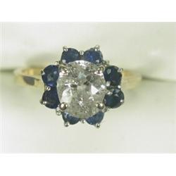 A sapphire and diamond cluster ring set with an old mine cut diamond of approx 1.50cts, set in 18...