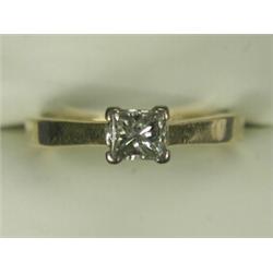 A Princess cut diamond solitaire ring of approx. 0.50ct, set in 18ct white gold to a yellow shank...