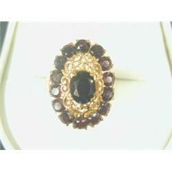 An 18ct gold garnet cluster ring, size M Est. 200/250...