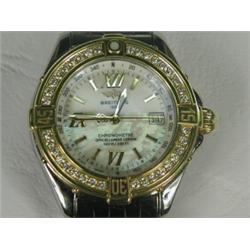 A lady's Breitling Chronom Etre stainless steel and gold wristwatch with a mother of pearl dial a...