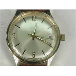 A Garrard 9ct gold automatic gent's wristwatch, hallmarked 1974, with a lizard strap Est. 450/500...