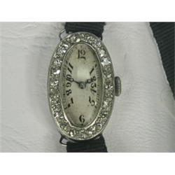 An Art Deco platinum and diamond cocktail watch, dial 20 x 10mm Est. 450/650...