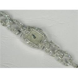 A lady's diamond cocktail watch, tests platinum (bracelet broken) Est. 500/700...