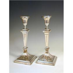 A pair of Neo-Classical style plated candlesticks with a crest on the drip pan (both repaired), 2...