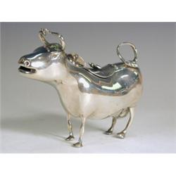 A silver 'Schuppe' type cow creamer with foreign marks and import mark for Sheffield, 1899, 10cm...
