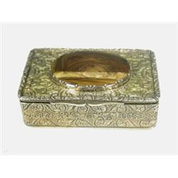 An Irish silver gilt box with an oval hardstone inset cabochon to the hinged lid opening to revea...