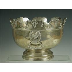 A Victorian silver Monteith with a cast rim and hinged handles, cast with lions' masks dolphins a...