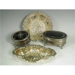 A late Victorian pierced silver dressing table dish with cherub repousse work, London 1898 and th...
