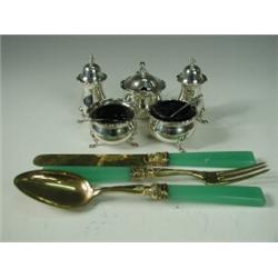 A five-piece silver condiment set, Sheffield 1912, together with a continental knife, fork and sp...