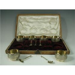 A set of six Russian white metal salts, with five matching spoons in a fitted case, each piece st...