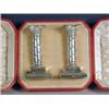 Image 1 : A pair of Victorian silver candlesticks, of classical form with spiral husk decoration, on steppe...