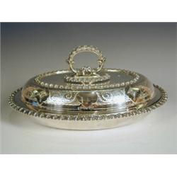 A Victorian oval silver entree dish and cover, with chased and gadrooned borders, and engraved sc...