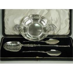 An Edwardian silver quaich by the Goldsmiths & Silversmiths Company, 1905, and a cased set of sil...