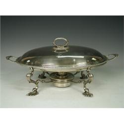 A 19th Century silver vegetable dish on a silver plated stand with burner, London 1869, maker SW...