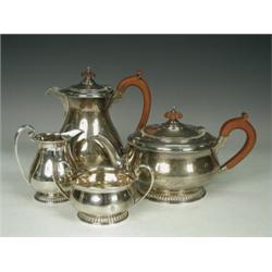 An Art Deco four piece tea service, London 1931, retailed by Harrods, 58ozs gross Est. 400/600...