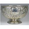 Image 1 : A late Victorian silver punch bowl, repousse decorated with foliage and 'c' scrolls and two vacan...