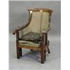 Image 1 : A Regency mahogany bergere reading chair with padded arms (pads missing) and brass fittings for r...