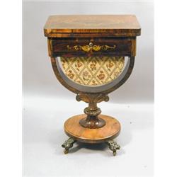 A Victorian rosewood work table with a fold over top, a frieze drawer, basket and painted decorat...