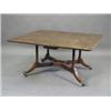 Image 1 : A George III mahogany Cumberland table with drop leaves on turned supports and brass castors, 131...
