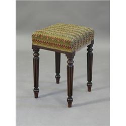 A George III mahogany stool in the manner of Gillows, having a square upholstered seat on turned...