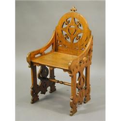 A Victorian Gothic oak hall chair with fret-cut decoration Est. 250/350...