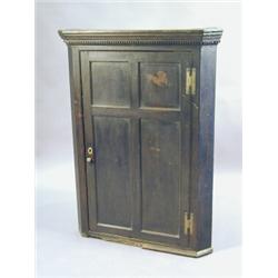 A George III oak hanging corner cabinet with a single panelled door, 91cm wide Est. 150/250...