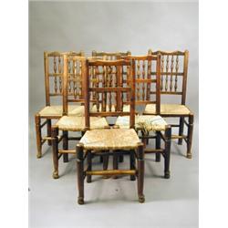 A matched set of six early 19th century ash single chairs with spindle backs and rush seats Est....