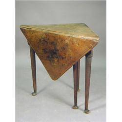 A George III mahogany triangular corner table on four turned club foot legs, 89cm wide (various d...
