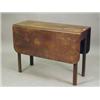 Image 1 : A George III mahogany drop leaf table, the top on four chamfered square legs, 99 x 102cm Est. 200...
