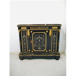 A 19th century continental ebonised side cabinet having a marble top over a single door and panel...