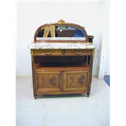 A 1920's French mahogany buffet with a marble top and gilt metal mounts, 120cm wide Est. 300/500...