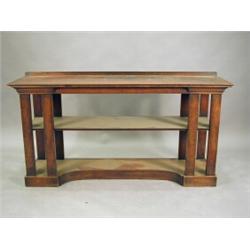 A 19th century mahogany serving table raised on square columns with a single undertier, on an inv...