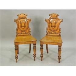 A pair of Victorian oak hall chairs Est. 200/300...