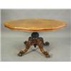 Image 1 : A Victorian burr walnut veneered loo table with a quarter veneered top on four scrolling legs wit...