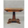 Image 1 : A Regency rosewood veneered fold over card table, the slender column with a base collar and a qua...
